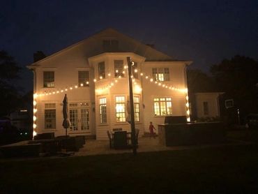 view of a house with lights on at night