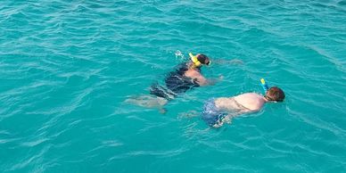 The poet snorkeling with his nephew, Tom, his marriage to Giandi the reason we were visiting the isl