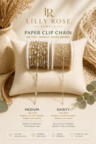 Elegant Lilly Rose paper clip chains in medium and dainty styles displayed on a cushion.