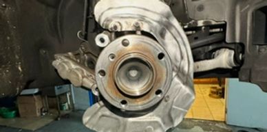 Close-up of a car brake disc and caliper.