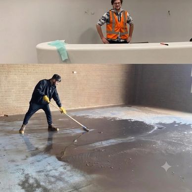 Two workers preparing a floor and countertop.