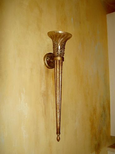 A picture of a fire light handle hanging on the wall