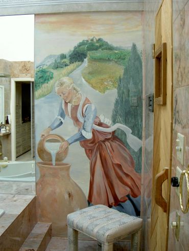 Artwork of a woman carrying water on the wall of a bathroom