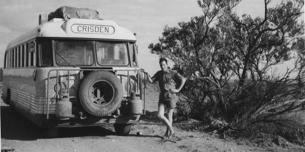 Man standing next to bus