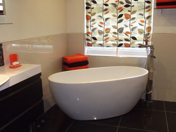 light bathroom with white bathtub on a marble floor