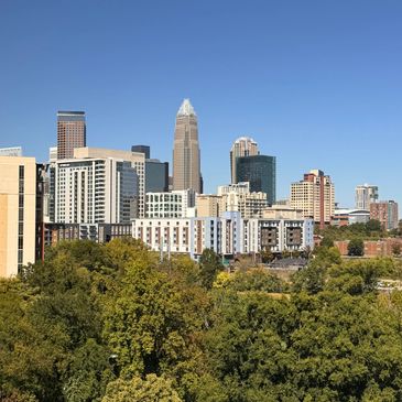 JAMES DENOBRIGA LONG LAW FIRM VIEW OF THE CHARLOTTE, NORTH CAROLINA SKYLINE OF SKYSCRAPERS. 