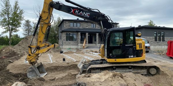 Excavator installing septic 