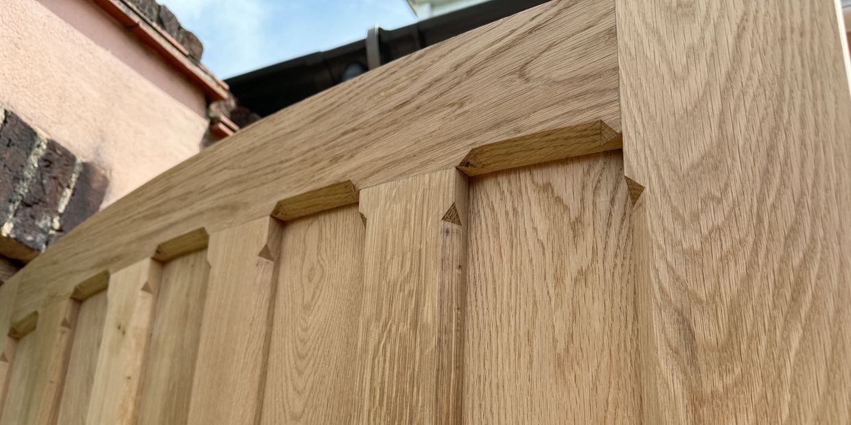 Bespoke solid oak arched door with stopped chamfer detailing made in Hampshire

