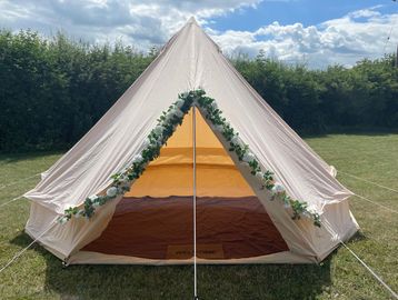 bell tent with flower decorations