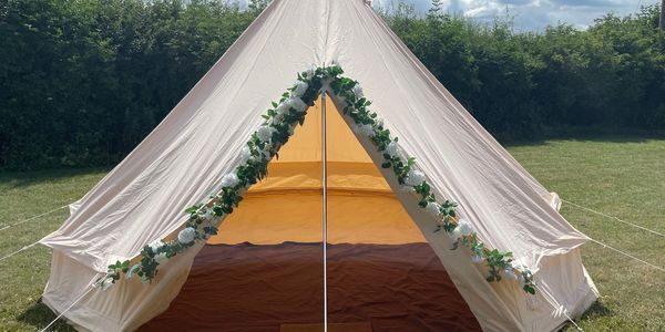 Bell tent with flowers for wedding