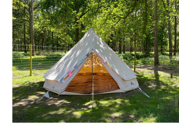 bell tent in woods with bunting
