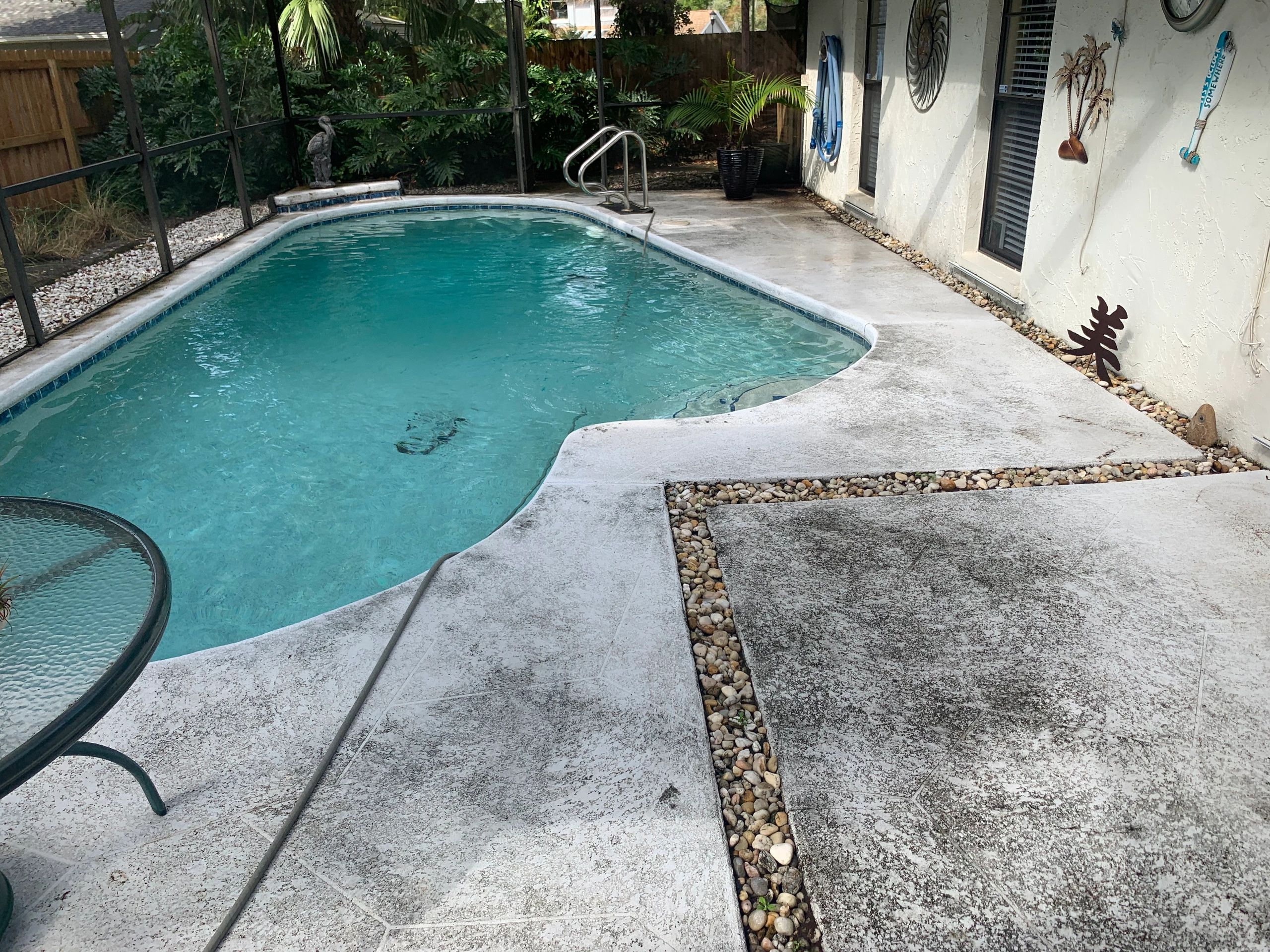 Pool deck before pressure washing