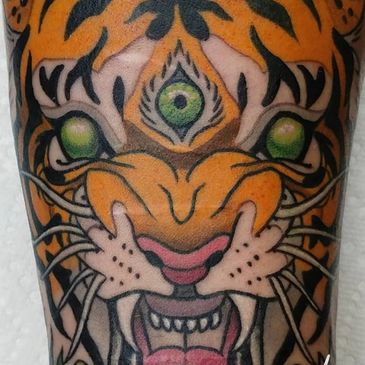 psychedelic full color neotraditional growling tiger tattoo