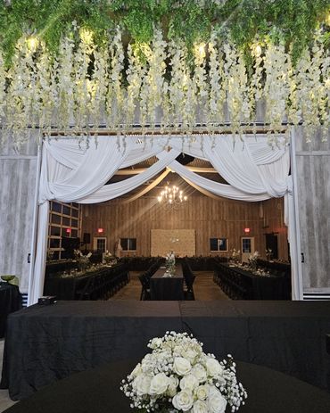 Elegant wedding venue with white floral decor.