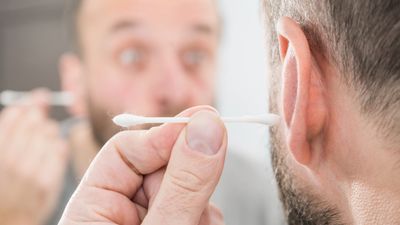 earwax ear wax hearing cotton bud wax build up occluding wax blocking ear canal