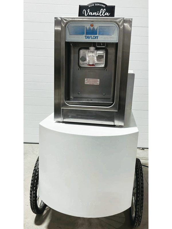 A Taylor soft serve ice cream machine labeled 'Vanilla' on a wheeled cart.