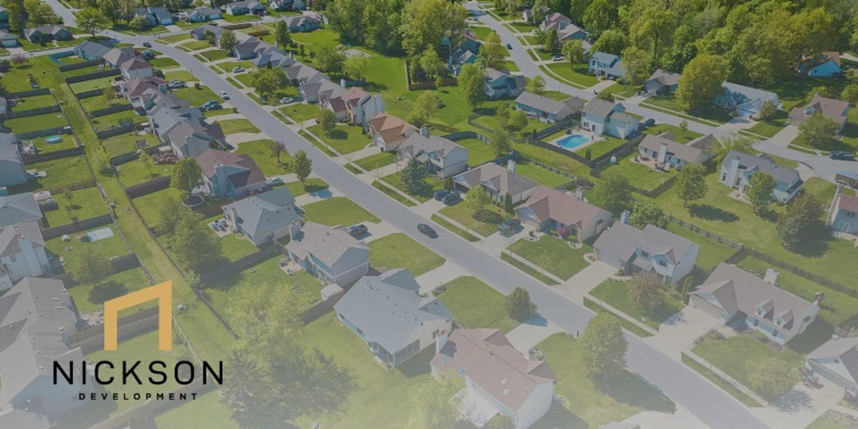 Aerial view of a suburban neighborhood with Nickson Development logo.