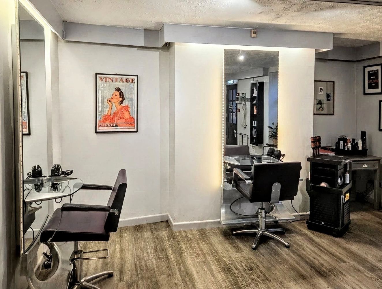 Interior of Castell Hair Salon, Holt, showing professional styling stations and salon chairs.