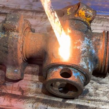 Laser cleaning an oil and gas valve.