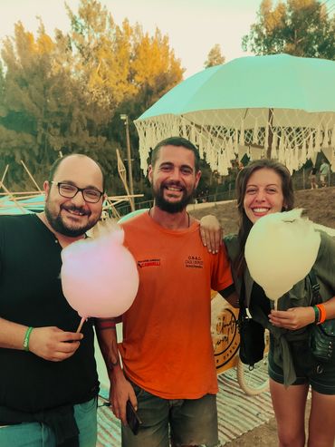 Group of happy customers eating a cotton candy cone 
