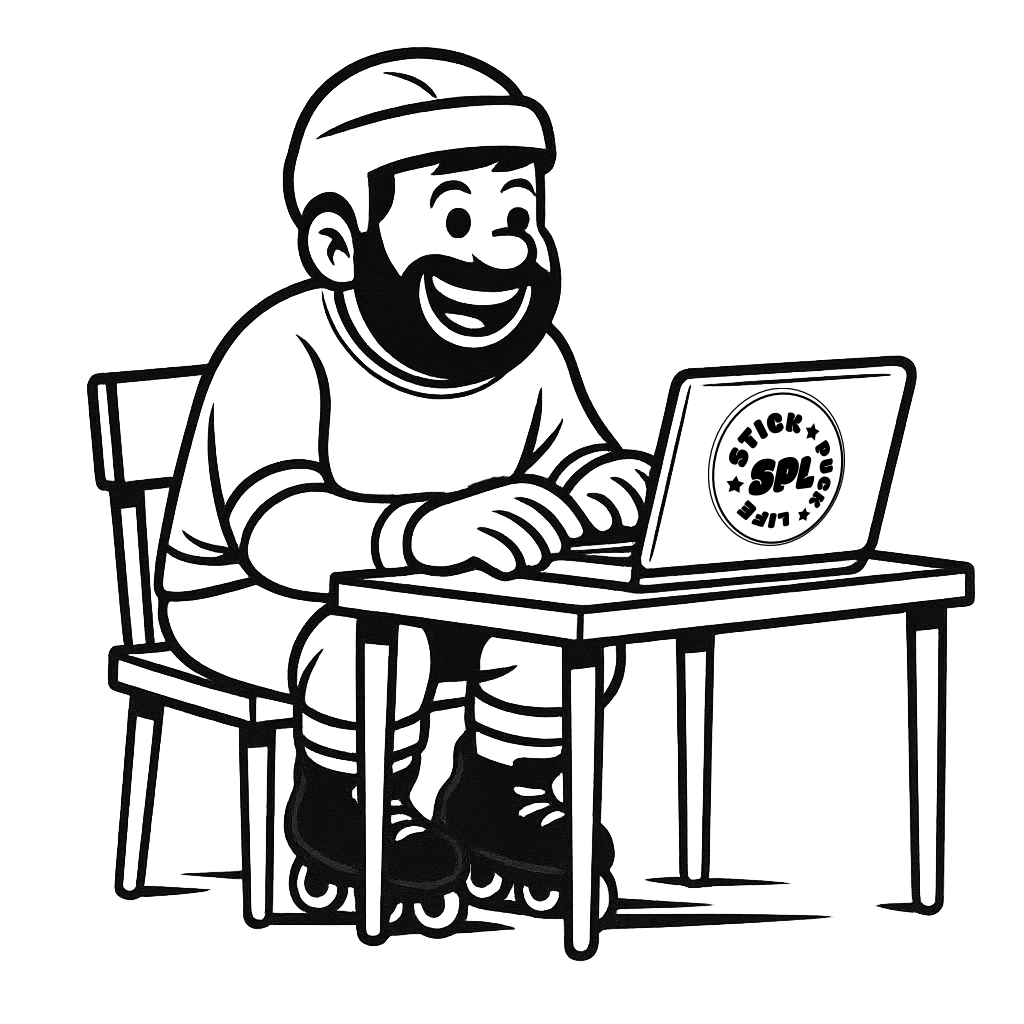 A happy inline hockey player sitting at a table  using a laptop at a table.