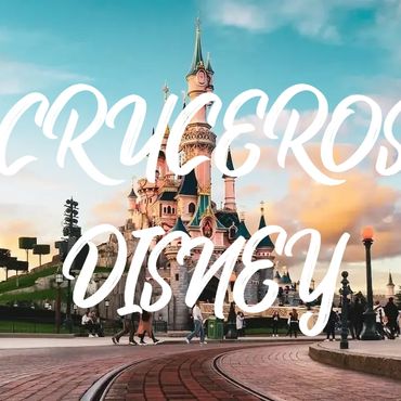 Disney castle with 'CRUCEROS DISNEY' text overlay at sunset.