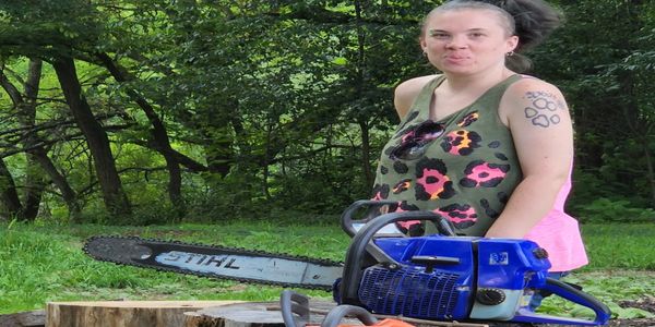 wife posing with chainsaws