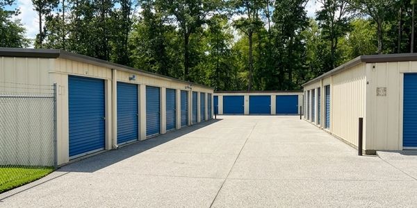 Outdoor storage units with blue doors.