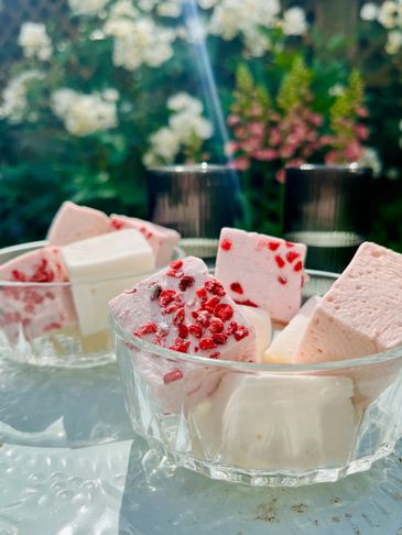 pink and white marshamllows in glass bowls