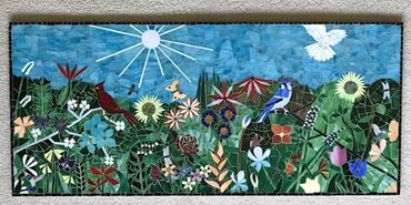 Colorful mosaic of flowers, birds, and butterflies under the sun.