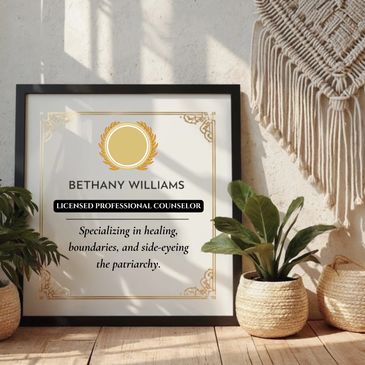 Framed counselor certification with plants and woven decor in natural sunlight.