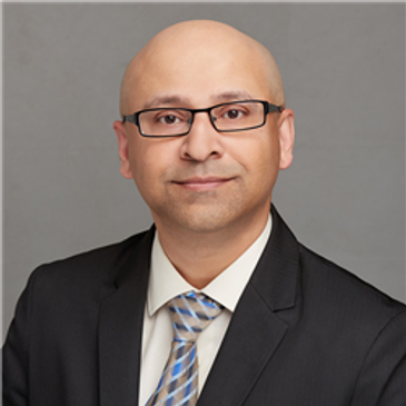 Professional man in suit with glasses.