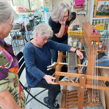 Weaving with a visiting artist. Partners all!