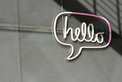 Photo of hello speech bubble, via Unsplash, credit Adam Solomon