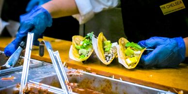 Photo of lunch line, via Unsplash, credit  Obi Onyeador