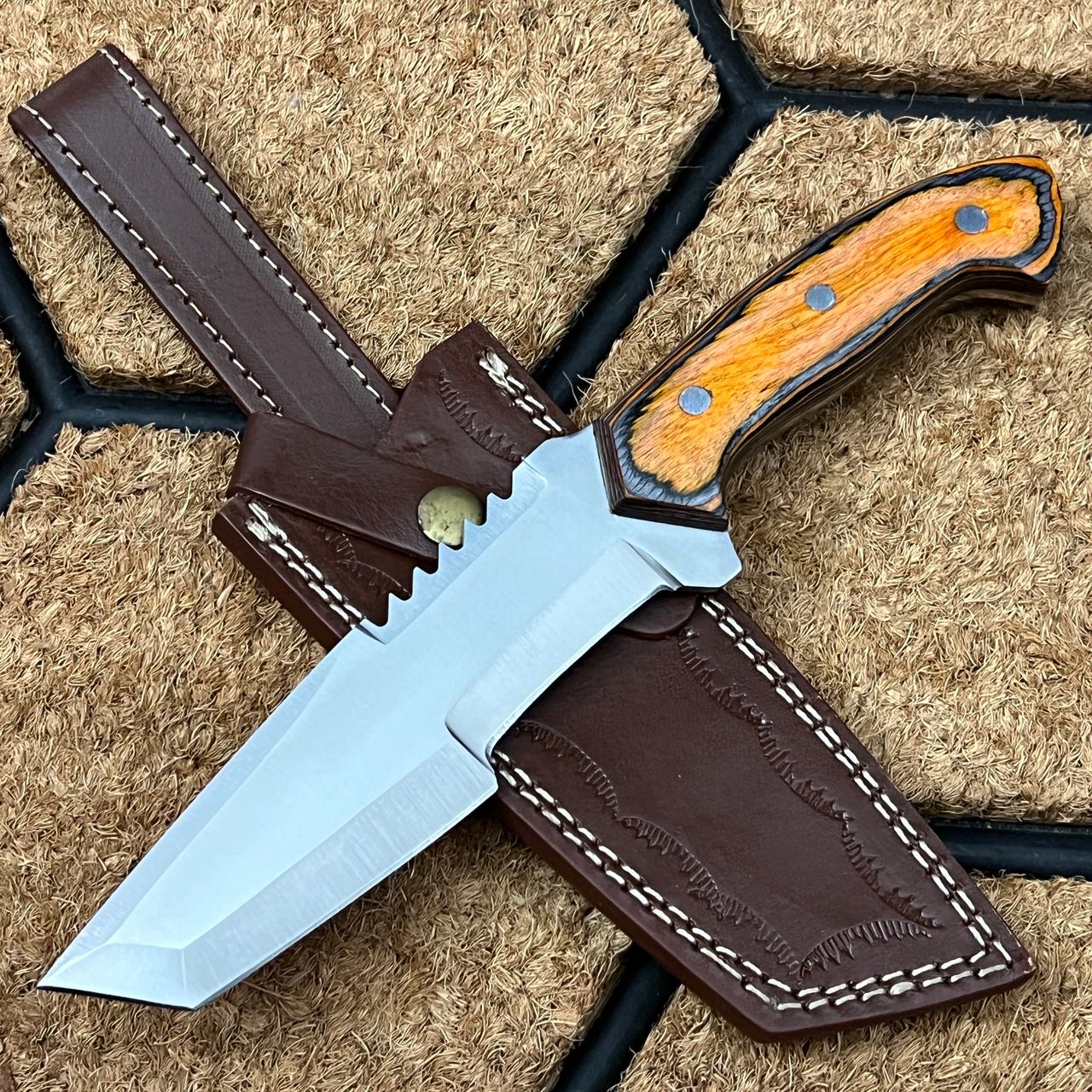 The ASH HK708 is a sturdy fixed-blade tanto knife constructed from high-quality materials like 440C Steel.