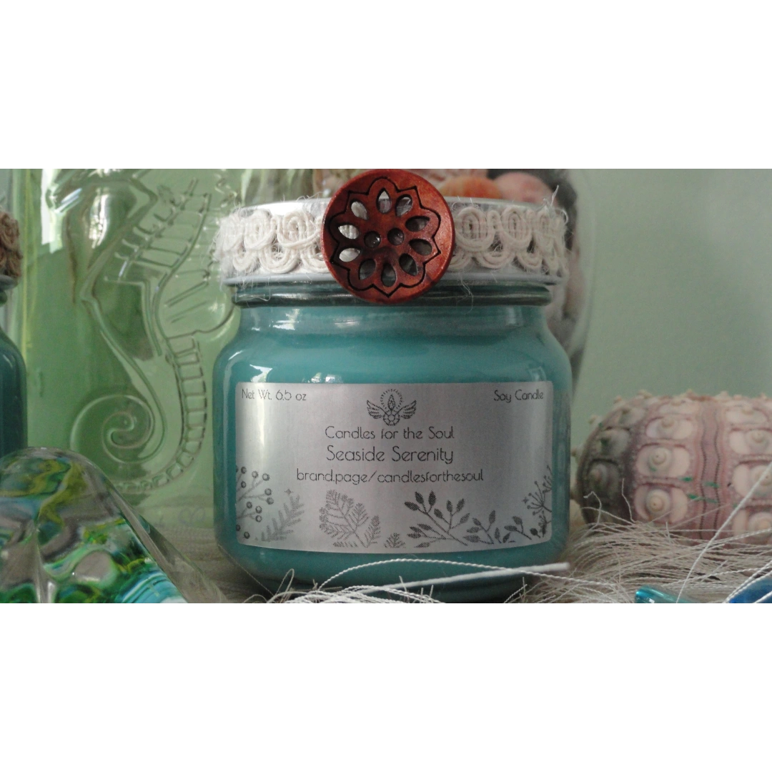 Highly scented Seaside Serenity soy candle decorated with a beachy flair.