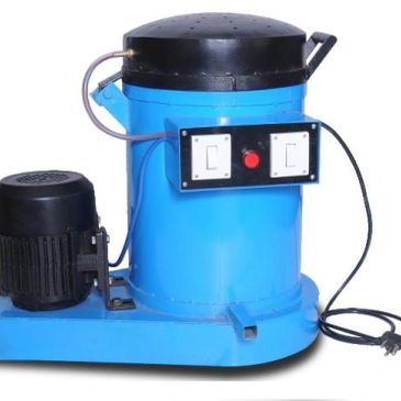 A blue industrial machine with motor and control switches.