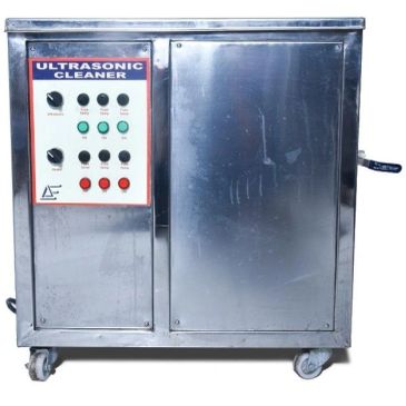 A stainless steel ultrasonic cleaner with control panel and wheels.
