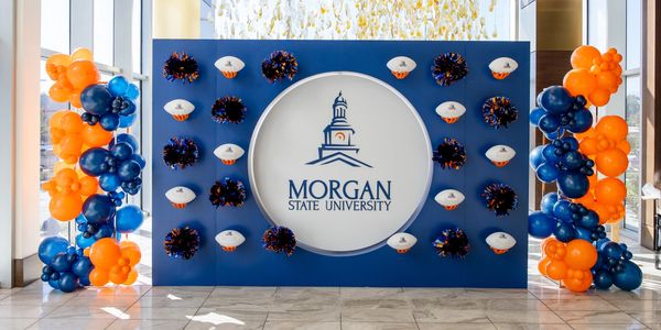 Morgan State University display with balloons and pom-poms.
