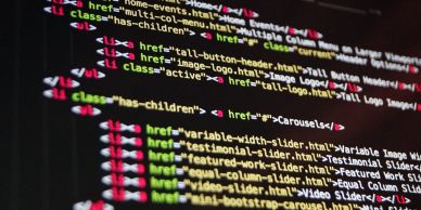 Close-up of colorful HTML code on a screen.