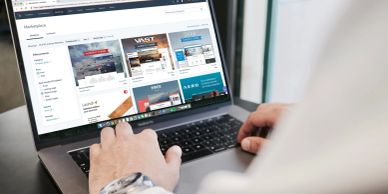 Person browsing a website on a laptop.