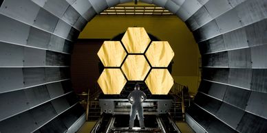 Array of large, hexagonal mirrors for use in the James Webb Space Telescope.