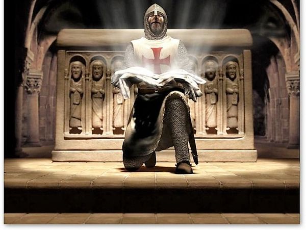 Knight in chainmail kneeling in front of a stone altar with a cross symbol on his tunic.