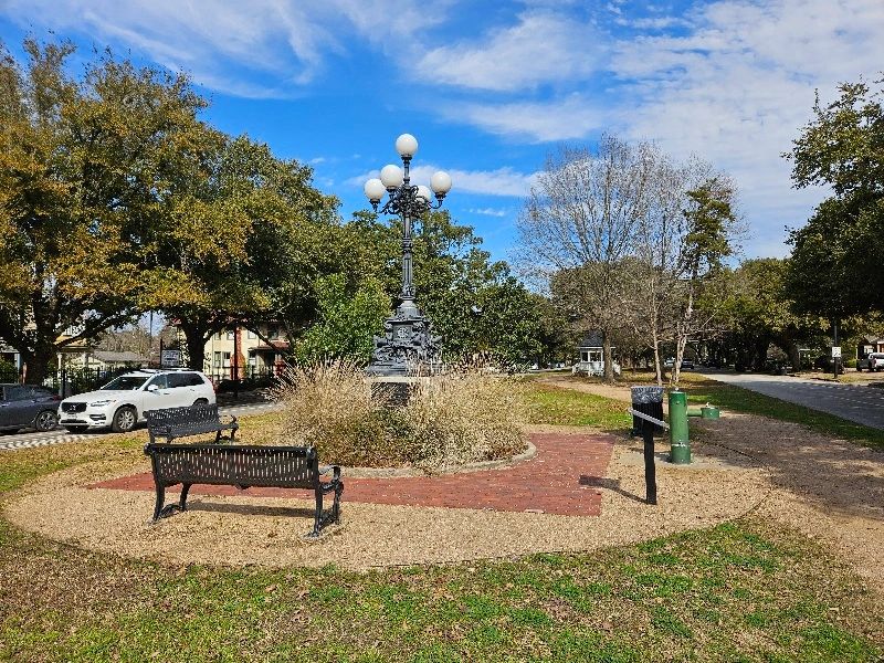Park and trail along Heights Blvd in the Greater Heights, Houston. A few benches and light fixture.