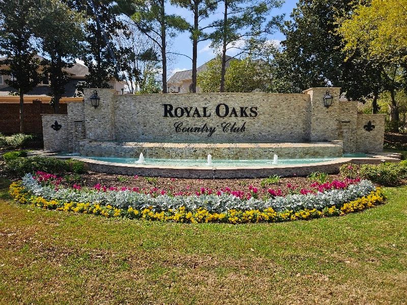 The entrance sign for Royal Oaks Country Club in Westchase, Houston, Texas. 