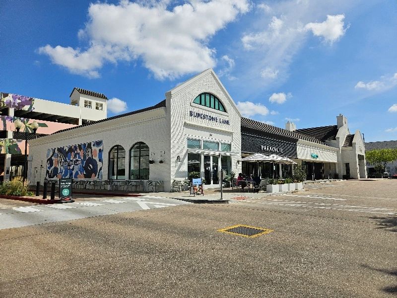 Store fronts and parking lot in Rice Village, Houston, Texas. 