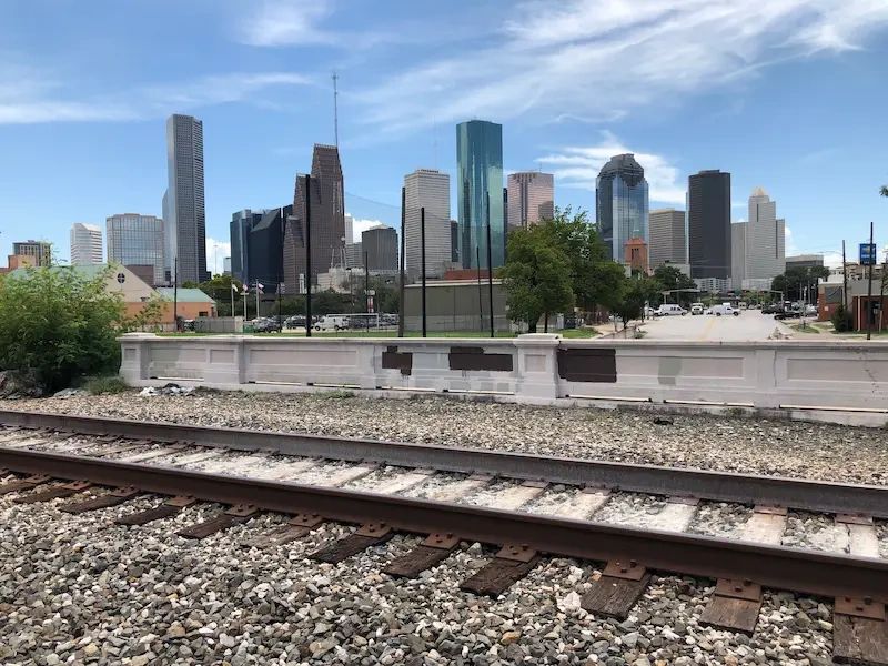 Professional upholstery cleaning near the Downtown Houston skyline on a beautiful day.