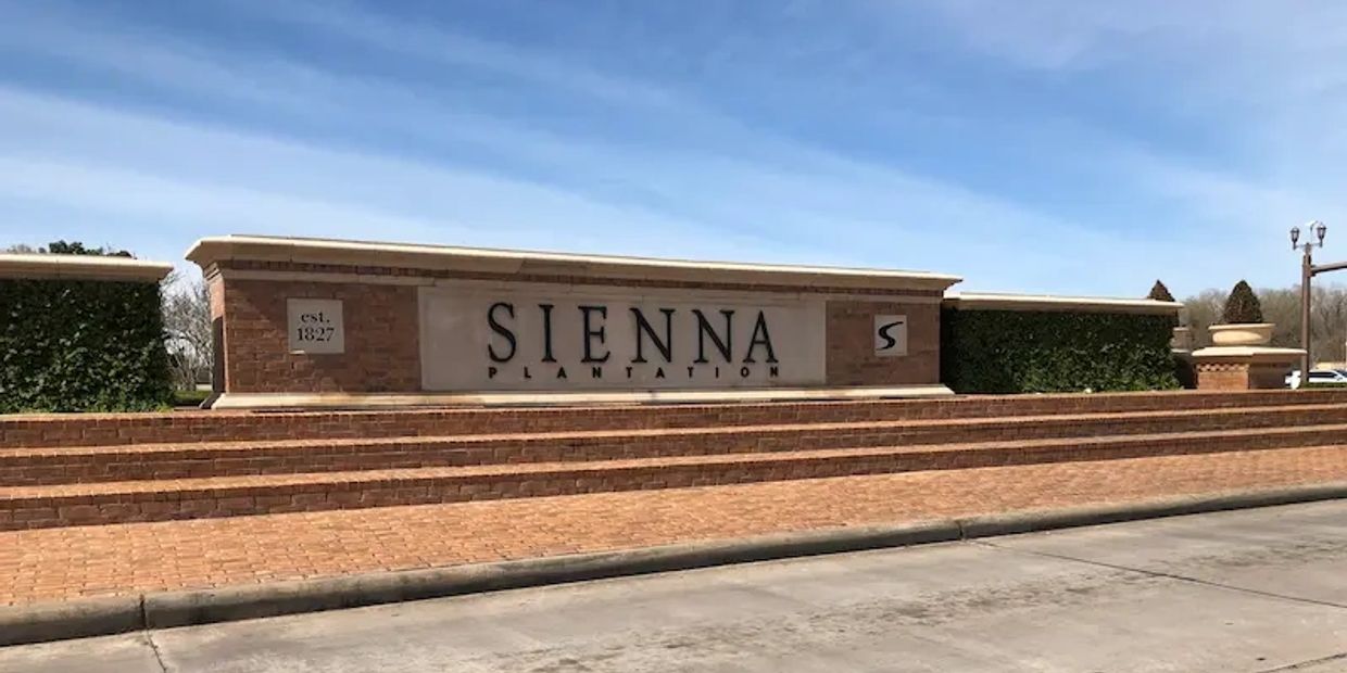 The entrance sign for Sienna Plantation in Missouri City, Texas.