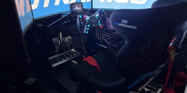 High-tech racing simulator cockpit with detailed controls.